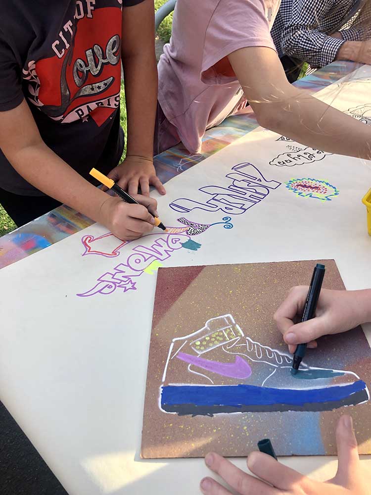 spray painted graffiti cards with stenciled hightops and shell toe designs