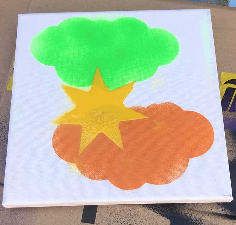 Shannons Clouds in orange and green with yellow star