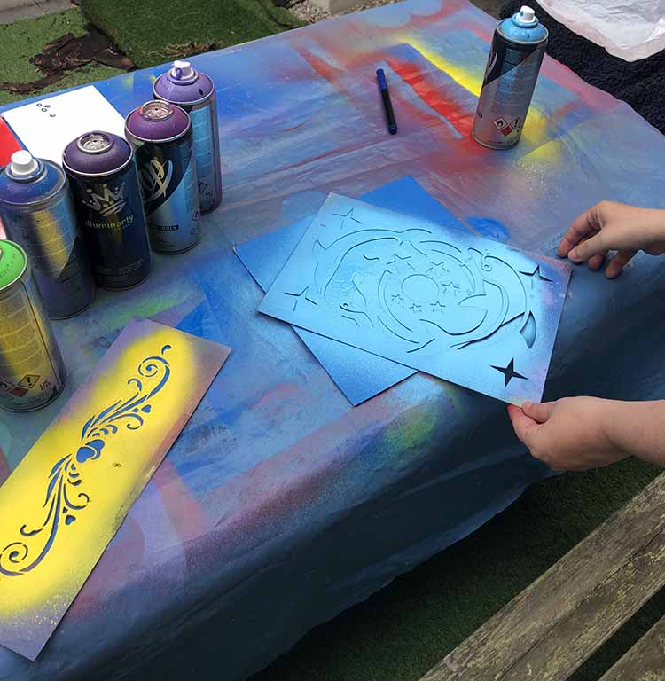 stencils and spray paint for a dolphin design