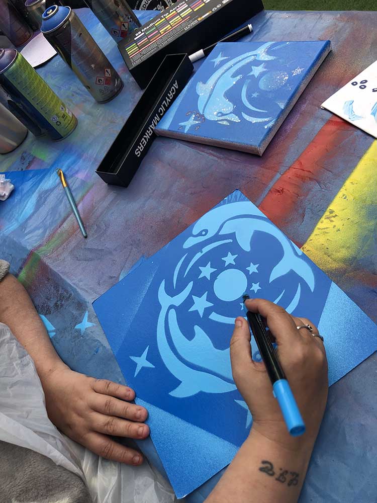 using paint pens to add to the design