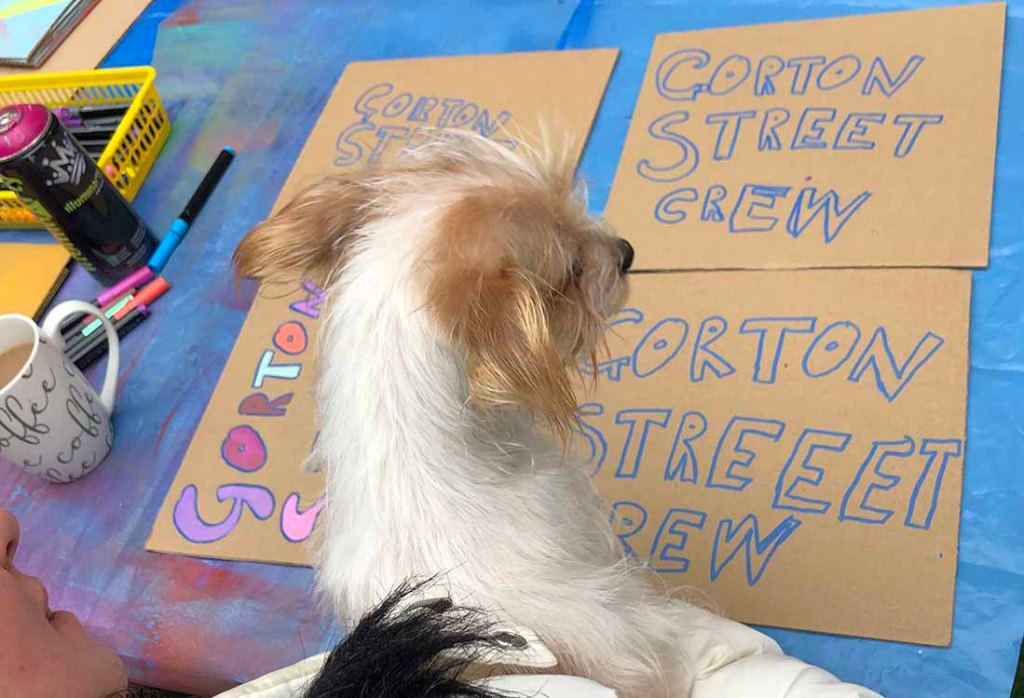 Gorton Street Crew signs paint pens on recycled card