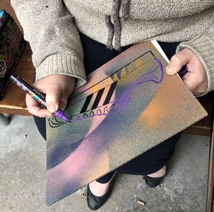 Happy feet making happy feet paint pen on spray painted card